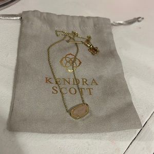Light pink Kendra Scott necklace.